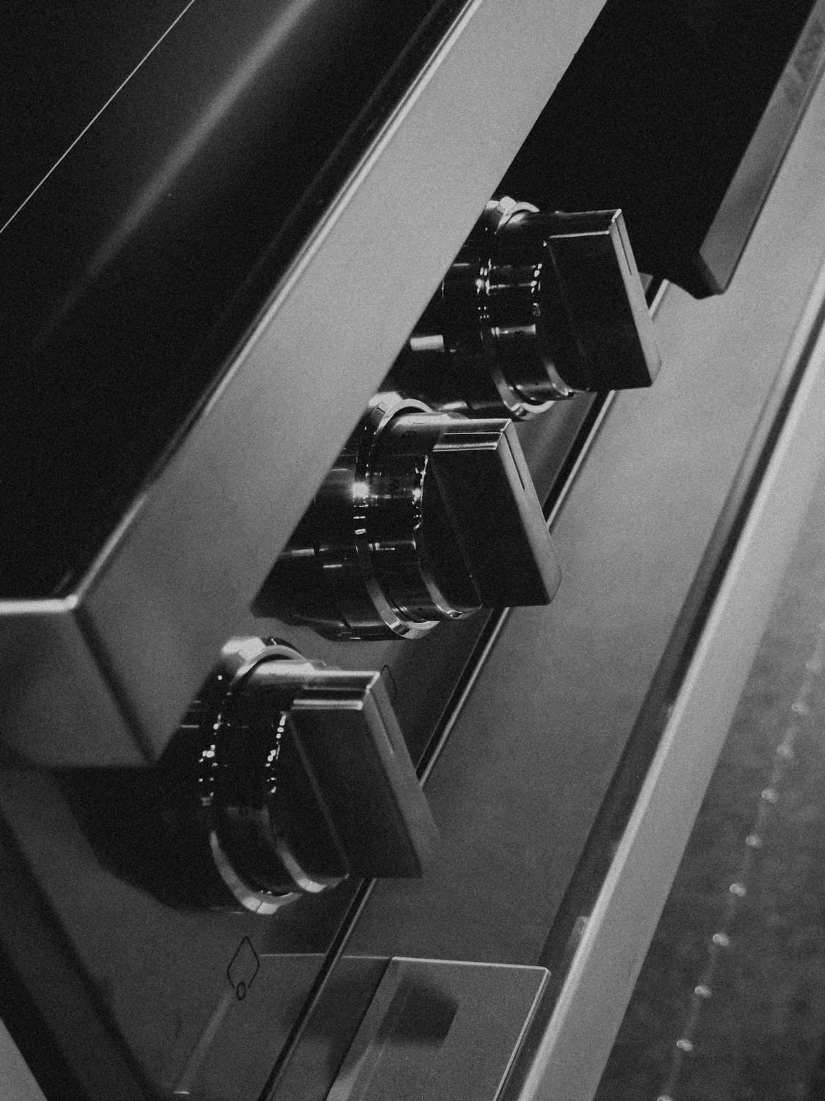 Close-up of the control knobs on a steel range